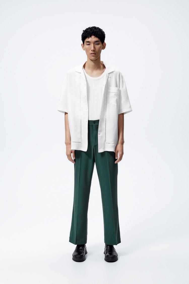 Bell bottom pants. Front and back pockets. Front zip and button closure. Bottle green ZARA United States